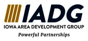 Four gold vertical bars next to ‘IADG’ in navy, with ‘Iowa Area Development Group’ in gray uppercase letters below and the tagline ‘Powerful Partnerships’ beneath.