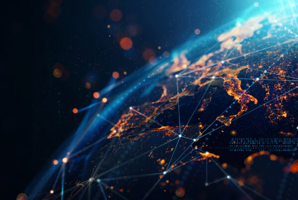 Teal digital world map with Western Europe highlighted, overlaid with circular HUD elements and connecting network lines on a dark background.