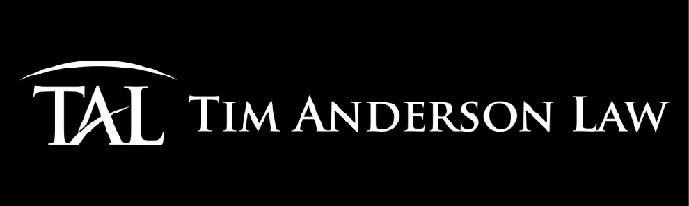White stylized ‘TAL’ initials with an arch above, followed by ‘Tim Anderson Law’ in white serif type on a black background.